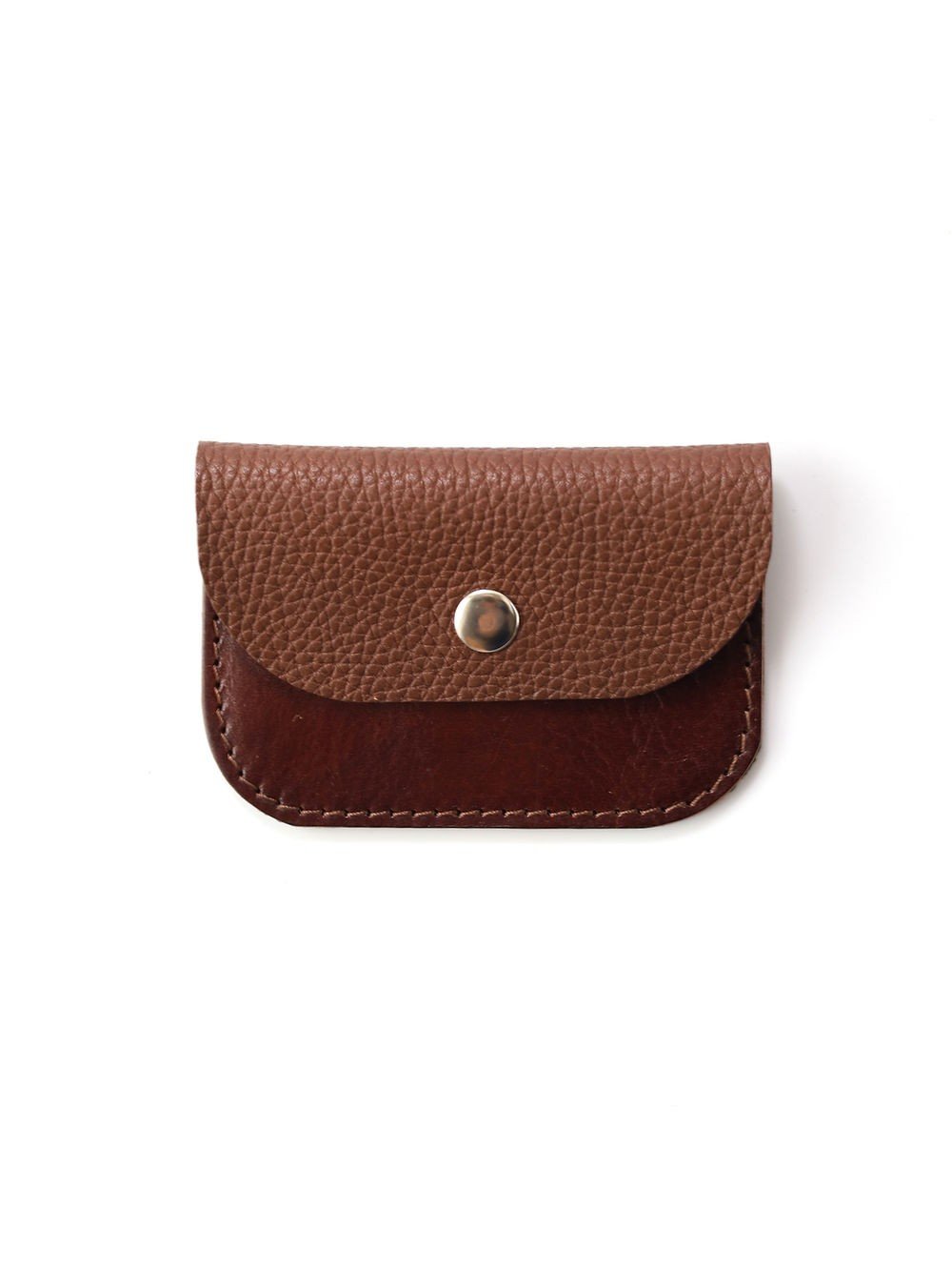 6. Flat lay of Toks Visoks brown and chestnut leather wallet with textured flap and metal snap closure