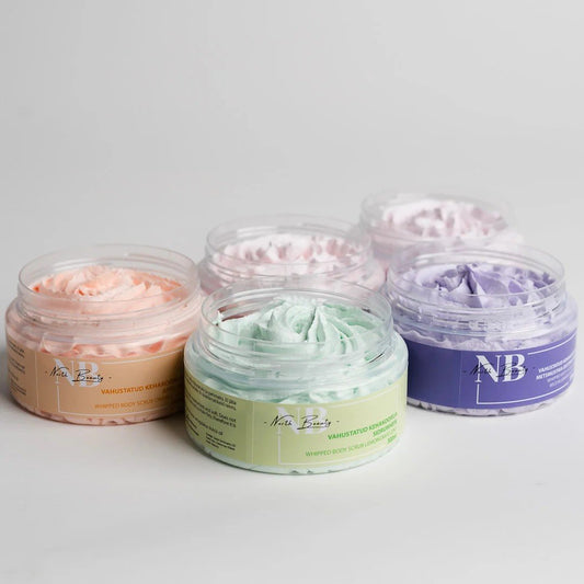 1. Assorted North Beauty whipped sugar body scrubs in various pastel colors, displayed in open jars