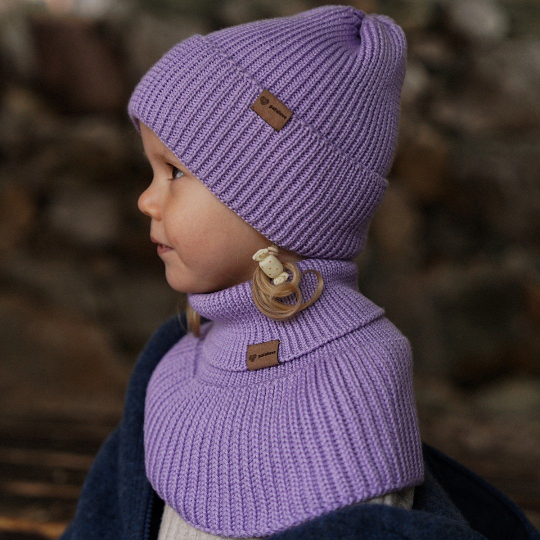 4. Child in lavender merino wool hat and neck warmer, side profile, outdoors