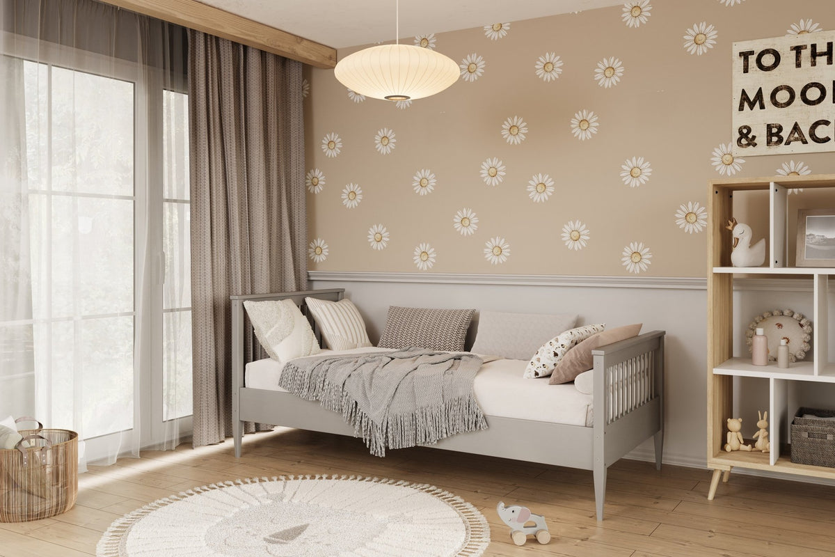 3. Gray wooden bed in stylish bedroom with floral wallpaper and soft furnishings
