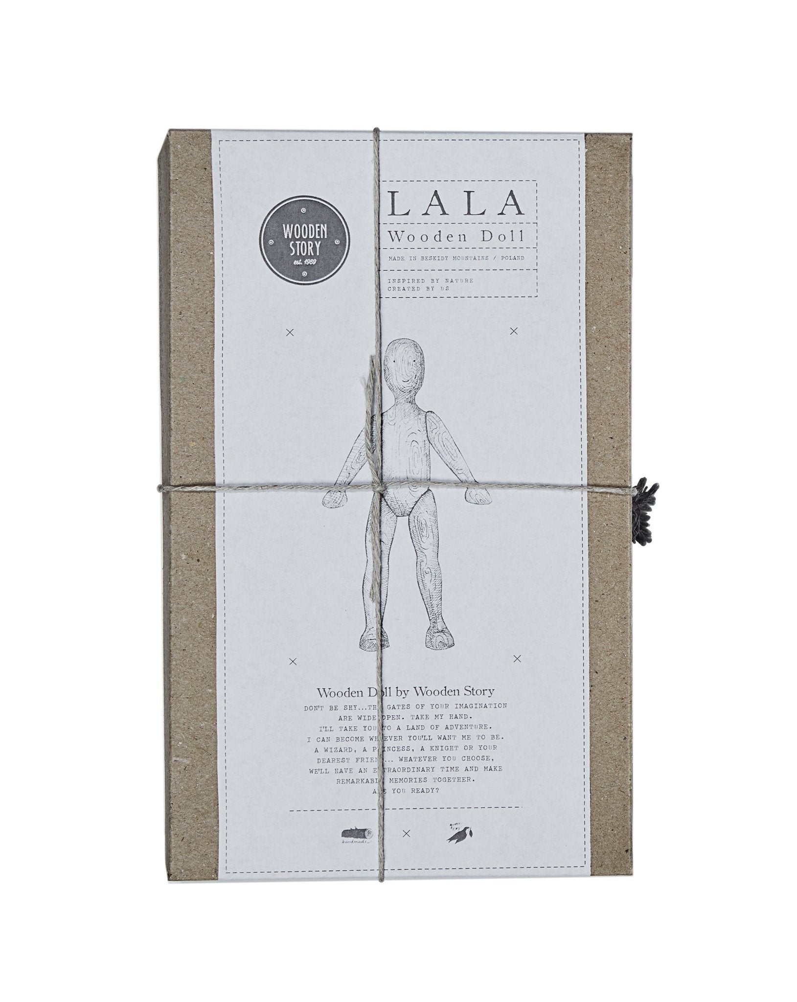 6. Top view of Wooden Story packaging with doll illustration and branding