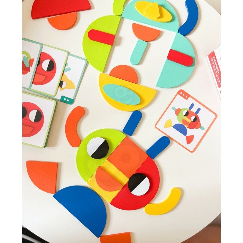 5. Colorful wooden blocks arranged in robot shape on table with cards