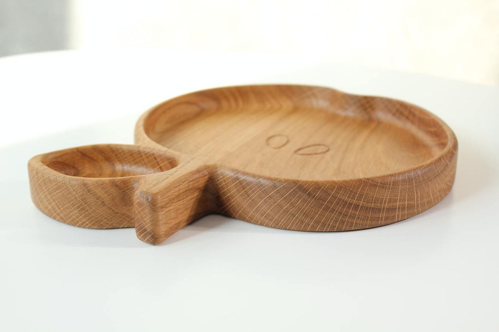5. Wooden apple-shaped plate for kids with a focus on the side profile and smooth edges, on a white background