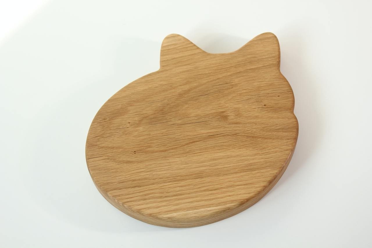 4. Flat lay of the back of a wooden fox-shaped plate, showing the natural wood texture and smooth finish