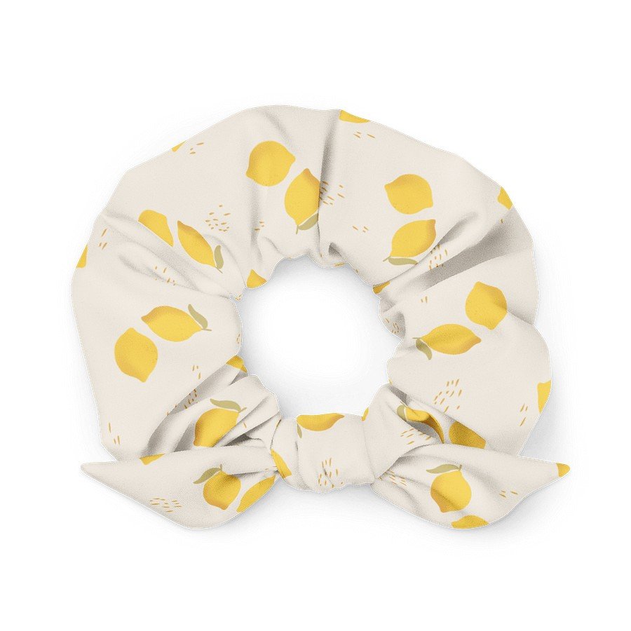 2. Eco-friendly beige scrunchie featuring yellow lemon pattern, displayed in a flat lay with a tied bow